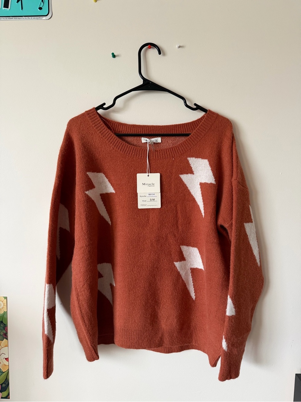 Miracle Rust Orange Crewneck Sweater with White Lightning Motifs